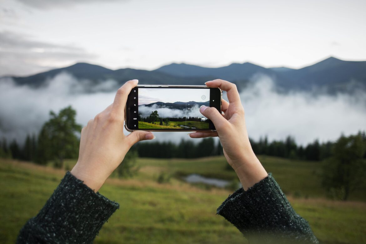 woman-taking-photo-rural-surroundings-min-scaled.